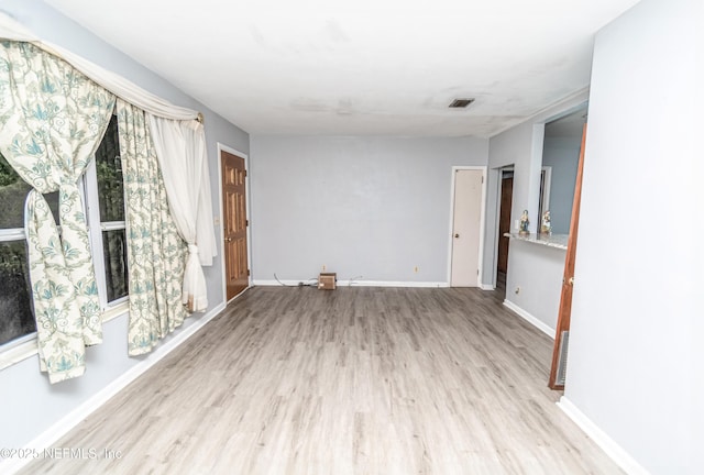 1165 5th St, Macclenny, FL 32063 - empty room with wood finished floors and baseboards