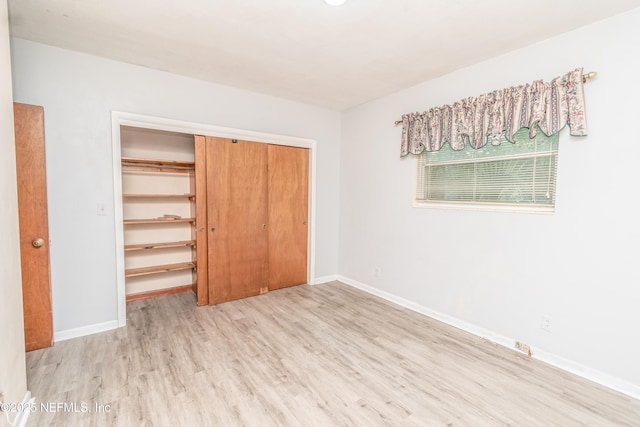 1165 5th St, Macclenny, FL 32063 - unfurnished bedroom featuring wood finished floors, a closet, and baseboards