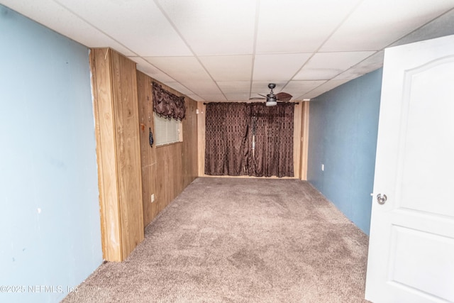 1165 5th St, Macclenny, FL 32063 - carpeted spare room featuring wood walls, a drop ceiling, and a ceiling fan