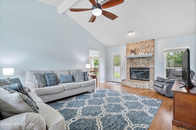 2760 Graniteridge Ct, Orange Park, FL 32065 - living area featuring beam ceiling, ceiling fan, wood finished floors, high vaulted ceiling, and a fireplace