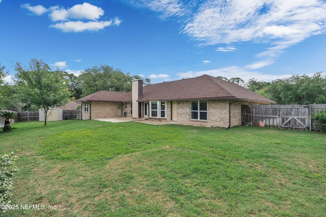 2760 Graniteridge Ct, Orange Park, FL 32065 - back of house with a patio area, brick siding, and a chimney