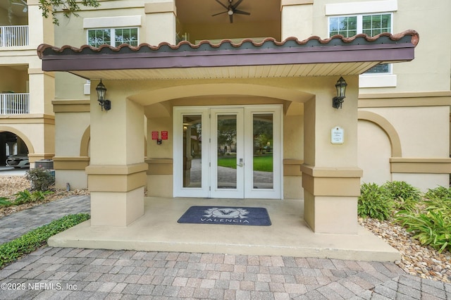 4300 S Beach Pkwy Unit 3214, Jacksonville Beach, FL 32250 - view of exterior entry with french doors and stucco siding