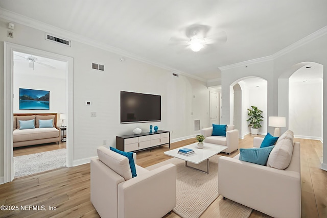 4300 S Beach Pkwy Unit 3214, Jacksonville Beach, FL 32250 - living area with ceiling fan, light wood-type flooring, arched walkways, crown molding, and baseboards