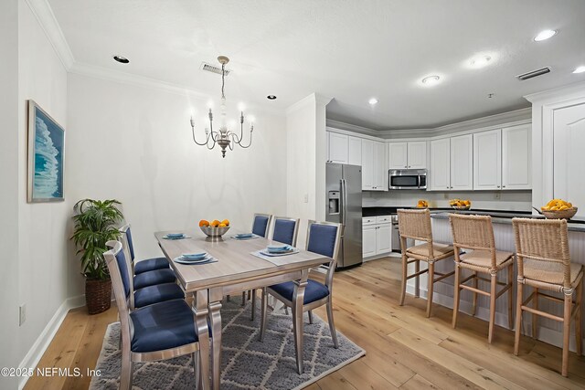 4300 S Beach Pkwy Unit 3214, Jacksonville Beach, FL 32250 - dining room featuring a chandelier, light wood-style floors, crown molding, baseboards, and recessed lighting