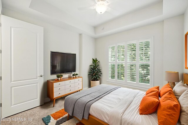 4300 S Beach Pkwy Unit 3214, Jacksonville Beach, FL 32250 - bedroom with a tray ceiling, carpet, and ceiling fan