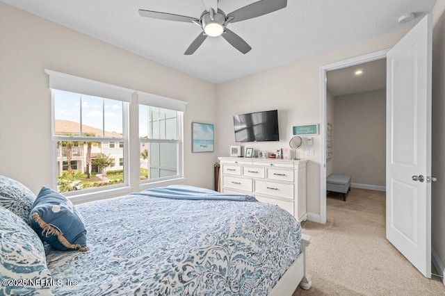 3603 Marsh Reserve Blvd, Jacksonville, FL 32224 - bedroom featuring light carpet, baseboards, and a ceiling fan