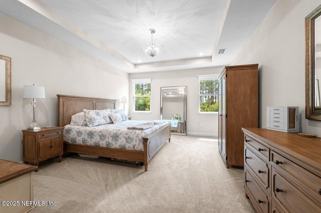 3603 Marsh Reserve Blvd, Jacksonville, FL 32224 - bedroom featuring light colored carpet, a chandelier, baseboards, and a tray ceiling