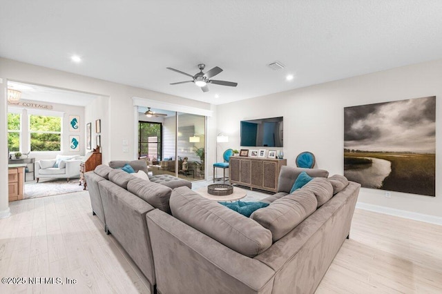 3603 Marsh Reserve Blvd, Jacksonville, FL 32224 - living room featuring light wood-style flooring, recessed lighting, a ceiling fan, and baseboards