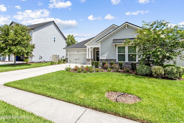 101 Bucktail Ave, Ponte Vedra, FL 32081 - craftsman house with driveway, a garage, a front yard, and stone siding