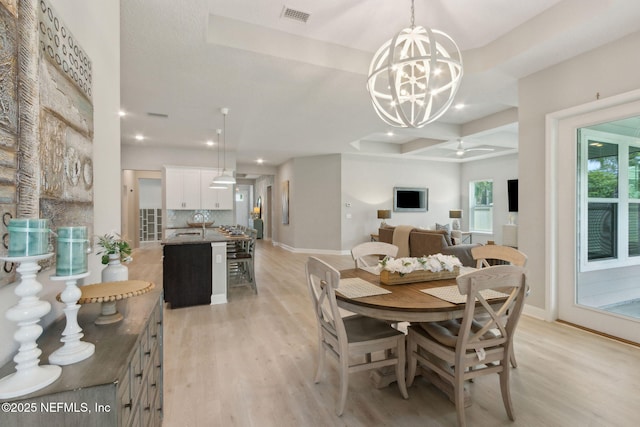 101 Bucktail Ave, Ponte Vedra, FL 32081 - dining space with light wood-type flooring, a chandelier, recessed lighting, a raised ceiling, and coffered ceiling