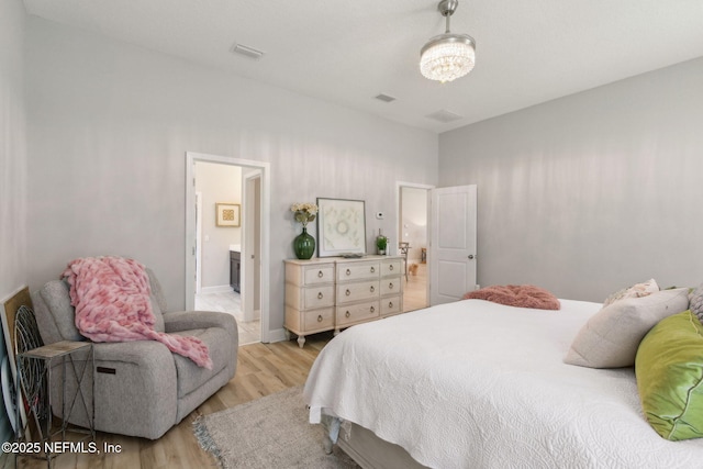 101 Bucktail Ave, Ponte Vedra, FL 32081 - bedroom with light wood finished floors and a chandelier