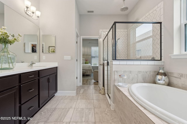101 Bucktail Ave, Ponte Vedra, FL 32081 - ensuite bathroom with vanity, a garden tub, a stall shower, and marble look tiles
