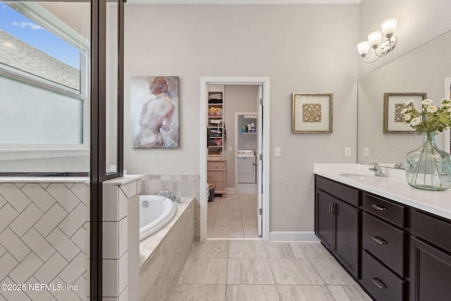 101 Bucktail Ave, Ponte Vedra, FL 32081 - full bath featuring vanity, a bath, a walk in closet, washer / clothes dryer, and tile patterned floors