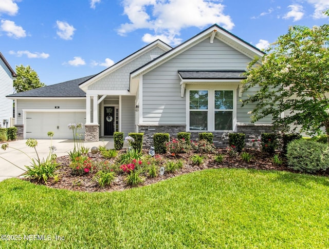 101 Bucktail Ave, Ponte Vedra, FL 32081 - craftsman house with a garage, driveway, a front yard, roof with shingles, and stone siding
