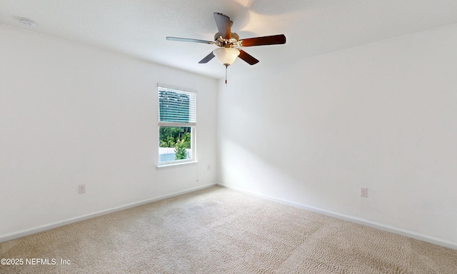 4171 Fishing Creek Ln, Middleburg, FL 32068 - empty room with baseboards, a ceiling fan, light carpet, and a smoke detector