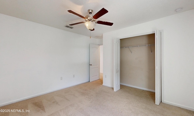 4171 Fishing Creek Ln, Middleburg, FL 32068 - unfurnished bedroom featuring carpet, a closet, baseboards, and ceiling fan