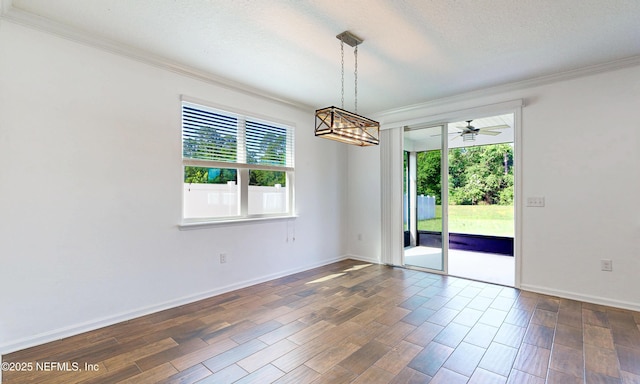 4171 Fishing Creek Ln, Middleburg, FL 32068 - unfurnished room with ornamental molding, plenty of natural light, dark wood-style flooring, a ceiling fan, and baseboards