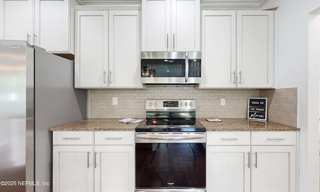 4171 Fishing Creek Ln, Middleburg, FL 32068 - kitchen with stainless steel appliances, decorative backsplash, and white cabinets