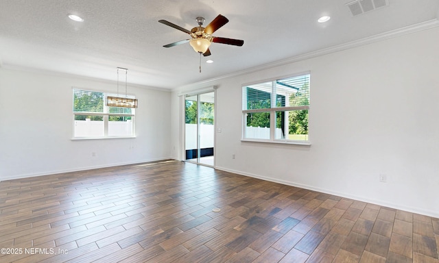 4171 Fishing Creek Ln, Middleburg, FL 32068 - spare room with ornamental molding, dark wood-style flooring, ceiling fan, recessed lighting, and baseboards