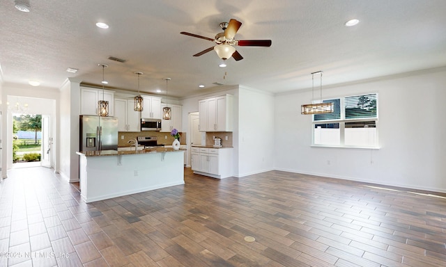4171 Fishing Creek Ln, Middleburg, FL 32068 - kitchen with appliances with stainless steel finishes, healthy amount of natural light, open floor plan, tasteful backsplash, and recessed lighting