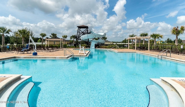 4171 Fishing Creek Ln, Middleburg, FL 32068 - community pool featuring a water slide, a pergola, and a patio area