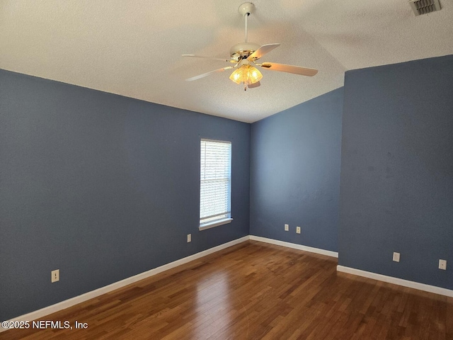 424 Bay Point Way N, Saint Johns, FL 32259 - spare room with vaulted ceiling, wood finished floors, ceiling fan, a textured ceiling, and baseboards