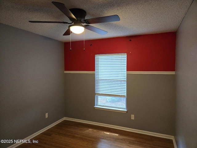 424 Bay Point Way N, Saint Johns, FL 32259 - empty room featuring wood finished floors, a textured ceiling, ceiling fan, and baseboards