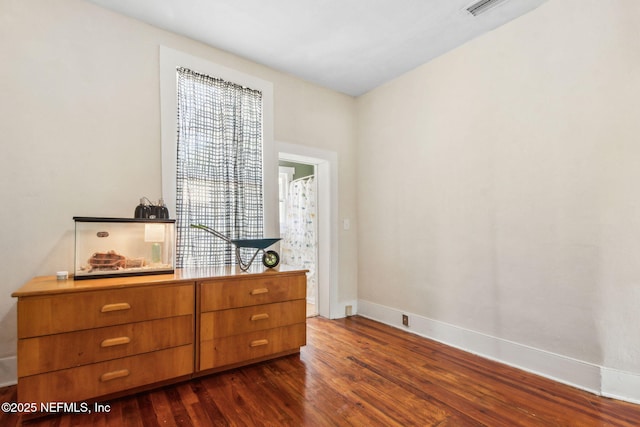 501 Beech St, Fernandina Beach, FL 32034 - bedroom with dark wood-type flooring and baseboards