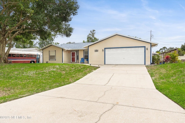 2910 Yule Tree Dr, Edgewater, FL 32141 - ranch-style home with a front yard, a garage, and driveway