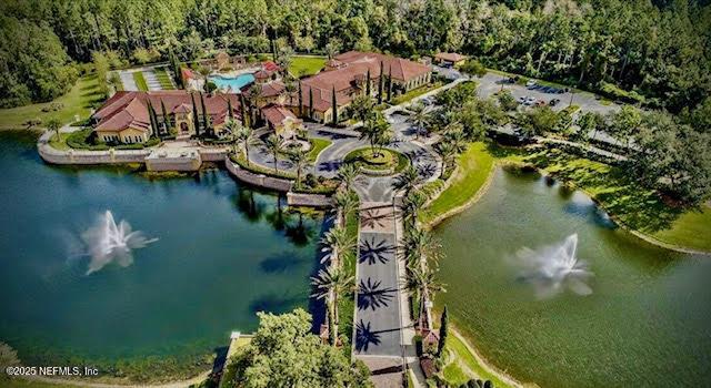 8561 Little Swift Cir Unit 32D, Jacksonville, FL 32256 - drone / aerial view of a large body of water and a forest