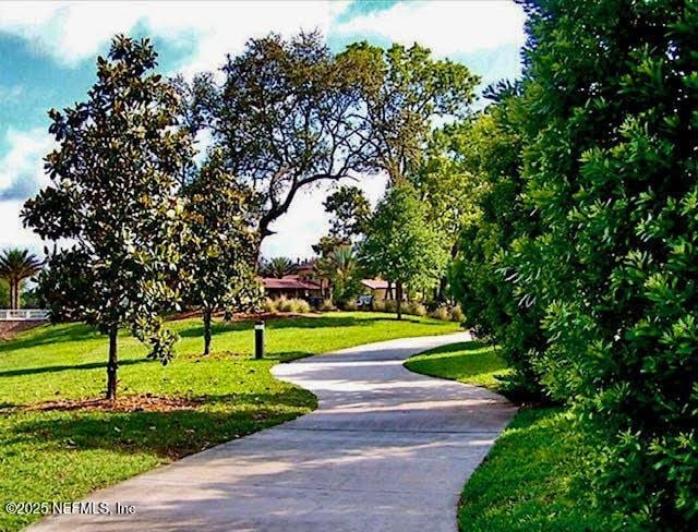 8561 Little Swift Cir Unit 32D, Jacksonville, FL 32256 - surrounding community with a yard