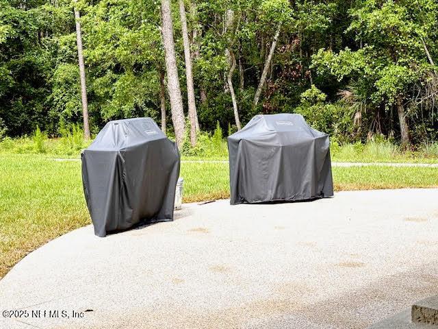 8561 Little Swift Cir Unit 32D, Jacksonville, FL 32256 - view of patio with grilling area