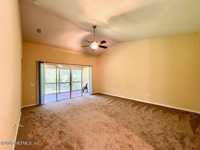 8561 Little Swift Cir Unit 32D, Jacksonville, FL 32256 - empty room featuring carpet floors, ceiling fan, lofted ceiling, and baseboards