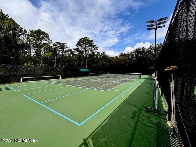 8561 Little Swift Cir Unit 32D, Jacksonville, FL 32256 - view of tennis court featuring community basketball court