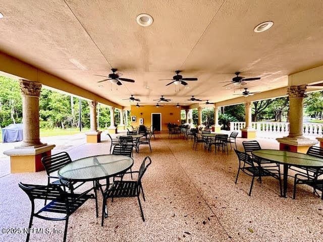 8561 Little Swift Cir Unit 32D, Jacksonville, FL 32256 - view of patio / terrace with outdoor dining area and a ceiling fan