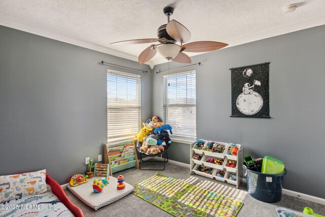 96290 Coral Reef Rd, Yulee, FL 32097 - rec room with carpet floors, a ceiling fan, baseboards, a textured ceiling, and ornamental molding
