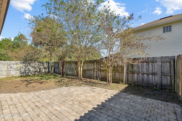 96290 Coral Reef Rd, Yulee, FL 32097 - fenced backyard featuring a patio