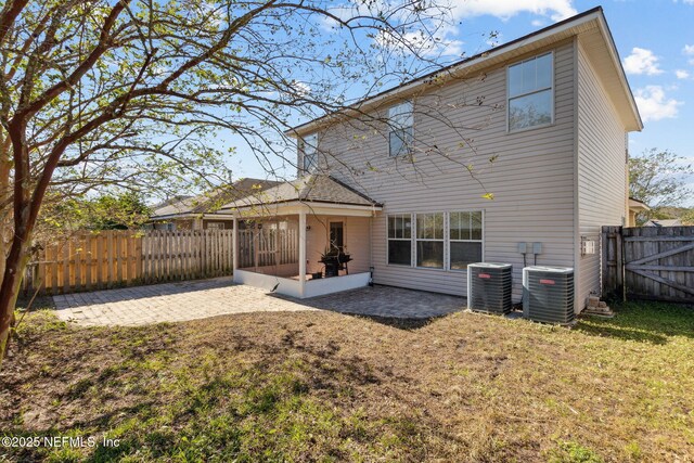 96290 Coral Reef Rd, Yulee, FL 32097 - back of house with a patio area, central AC, and a sunroom