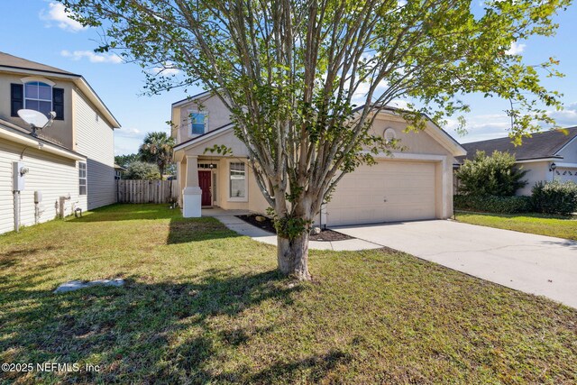 96290 Coral Reef Rd, Yulee, FL 32097 - view of front of home with driveway, an attached garage, and stucco siding
