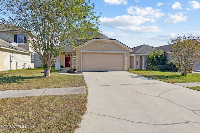 96290 Coral Reef Rd, Yulee, FL 32097 - view of front of property featuring a garage, driveway, stucco siding, and a front yard