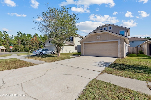 96290 Coral Reef Rd, Yulee, FL 32097 - view of front facade featuring a front yard, driveway, a garage, and stucco siding