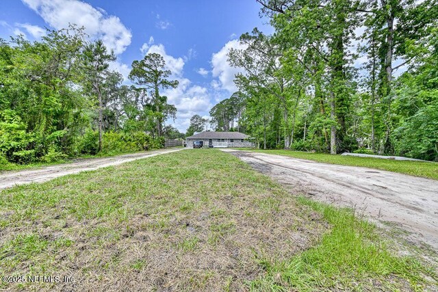 4966 Harvey Grant Rd, Fleming Island, FL 32003 - view of front of home featuring dirt driveway