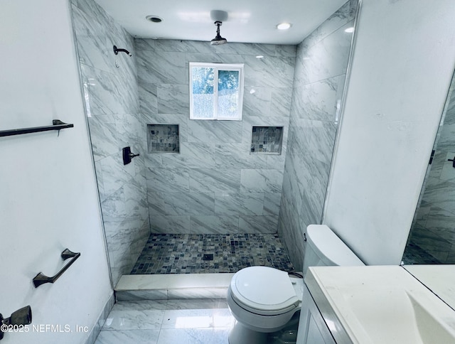 1041 E 14th St, Jacksonville, FL 32206 - bathroom featuring marble look tiles, toilet, a tile shower, vanity, and recessed lighting