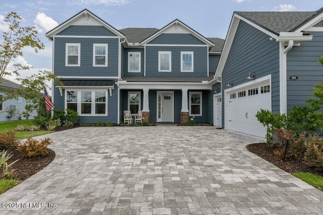 105 Awlleaf Ct, Saint Augustine, FL 32095 - craftsman house with decorative driveway, a porch, roof with shingles, and a garage