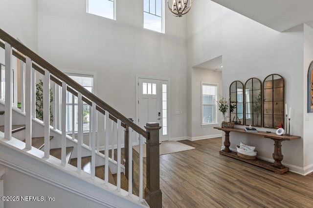 105 Awlleaf Ct, Saint Augustine, FL 32095 - foyer entrance with a towering ceiling, stairway, plenty of natural light, wood finished floors, and a chandelier