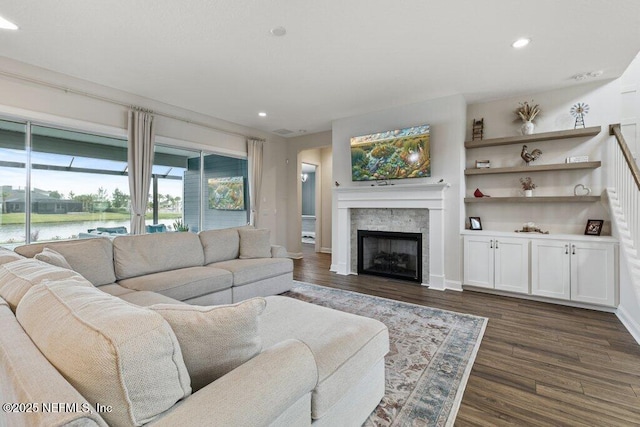 105 Awlleaf Ct, Saint Augustine, FL 32095 - living room featuring dark wood-type flooring, recessed lighting, a fireplace, and a water view