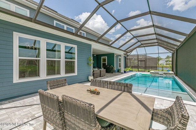 105 Awlleaf Ct, Saint Augustine, FL 32095 - view of swimming pool featuring a patio, outdoor dining area, a pool with connected hot tub, and glass enclosure
