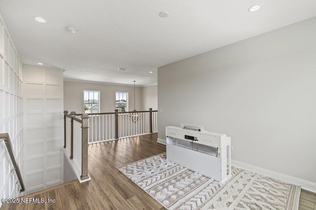105 Awlleaf Ct, Saint Augustine, FL 32095 - hall with an upstairs landing, wood finished floors, recessed lighting, and crown molding