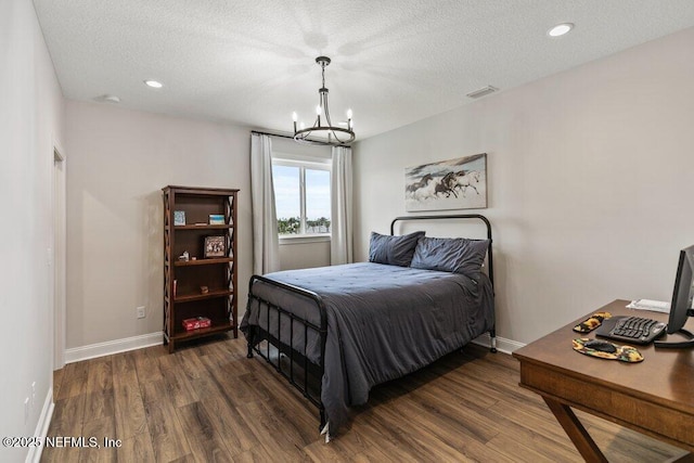 105 Awlleaf Ct, Saint Augustine, FL 32095 - bedroom featuring a chandelier, wood finished floors, a textured ceiling, and recessed lighting