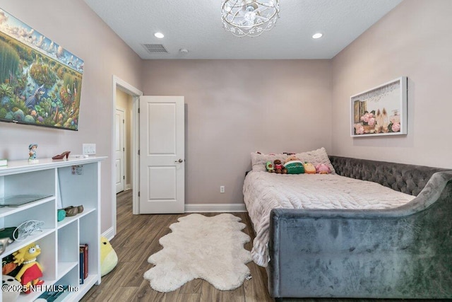 105 Awlleaf Ct, Saint Augustine, FL 32095 - bedroom featuring wood finished floors, a textured ceiling, and recessed lighting